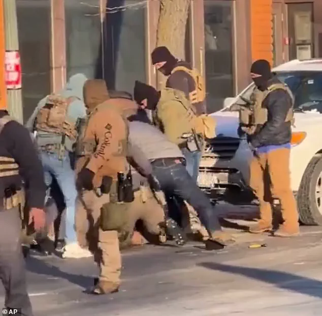 Fatal Shooting of Minneapolis Nurse by Border Patrol Sparks Debate Over Whether He Brandished Handgun