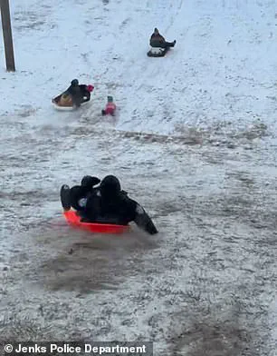 Oklahoma Police Officer Accidentally Sledding into Child in Viral Video Highlights Winter Weather Challenges