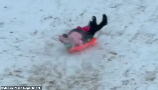 Oklahoma Police Officer Accidentally Sledding into Child in Viral Video Highlights Winter Weather Challenges