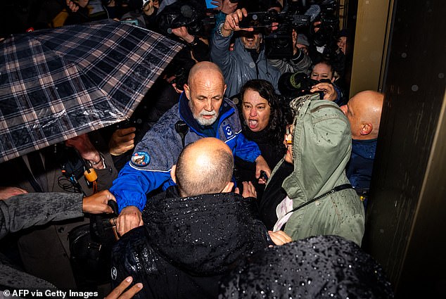 Mob of Grieving Families Confront Club Owners at Prosecutor's Office in Deadly Fire That Killed 41